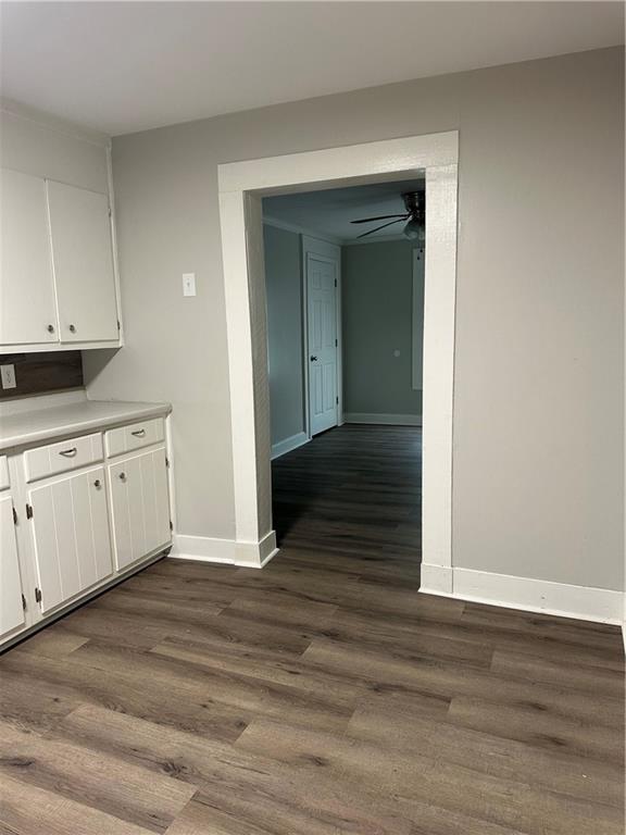 615 Cassville Road Southeast Cartersville, GA 30120 - Photo 9 of 24 a view of a kitchen with wooden floor and cabinets