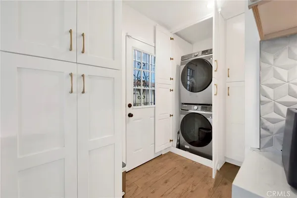 a view of a storage and utility room with washer and dryer