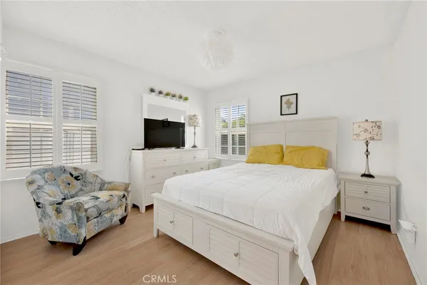 a bedroom with a bed and a couch