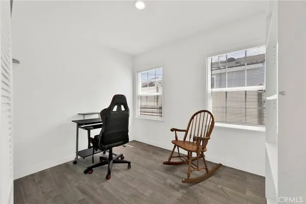 a workspace with furniture and a window