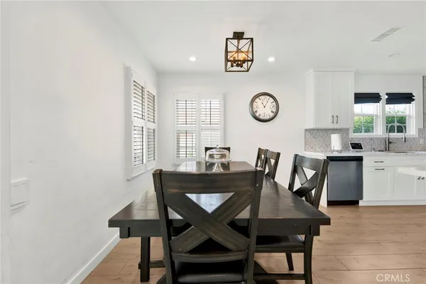 a view of a dining room with furniture and a window