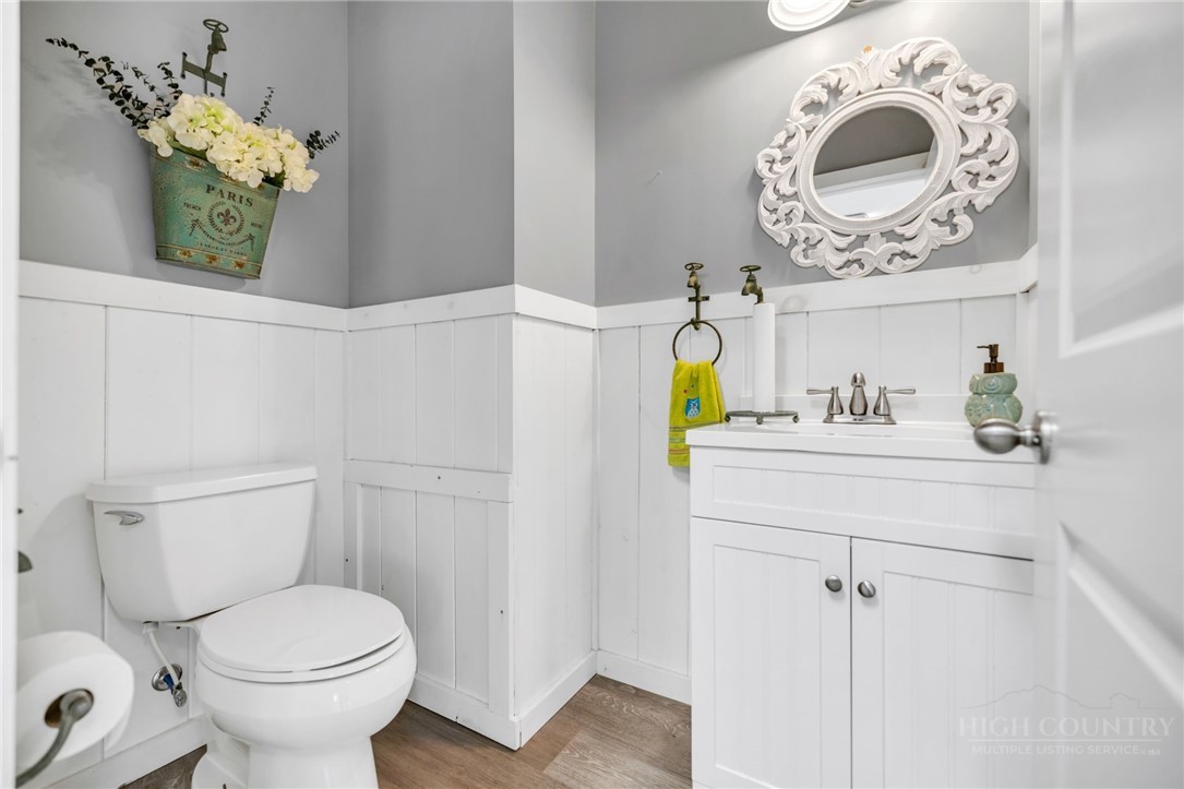 7994 3 Top Road Todd, NC 28684 - Photo 38 of 50 a bathroom with a toilet sink and mirror