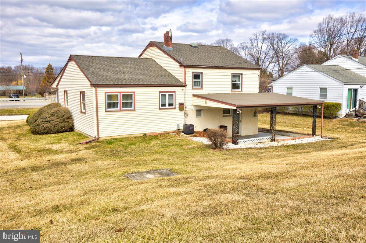 373 Lawrence Road Broomall, PA 19008 - Photo 29 of 30 a view of a white house with a yard and sitting area