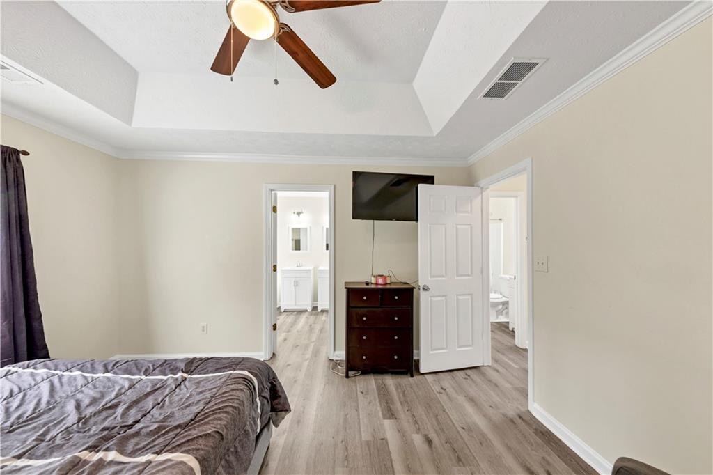 2880 Field Spring Drive Lithonia, GA 30058 - Photo 26 of 31 a bedroom with a bed and cabinets