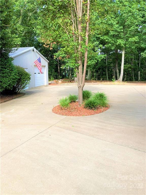 1258 South Mountain Road Bostic, NC 28018 - Photo 46 of 48 a front view of a house with a yard and tree s