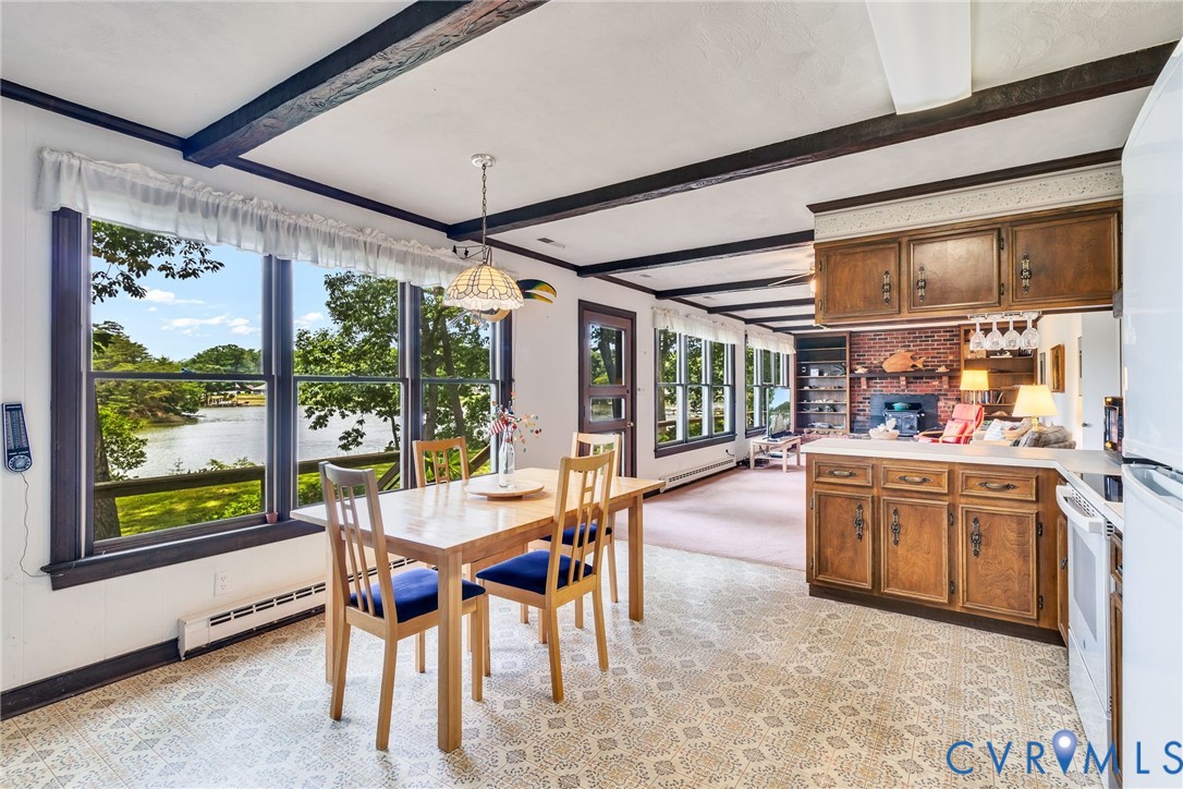 142 Bridge Lane Reedville, VA 22539 - Photo 2 of 56 a dining room with stainless steel appliances granite countertop furniture and a large window