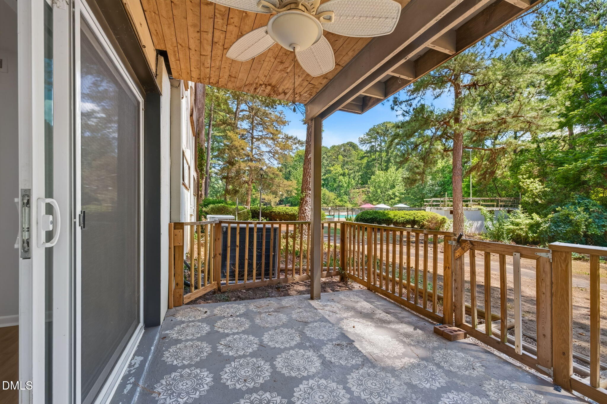 546 Pine Ridge Place Raleigh, NC 27609 - Photo 5 of 21 a view of a porch with wooden floor and outdoor space