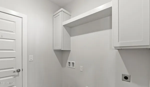 an empty room with closet area