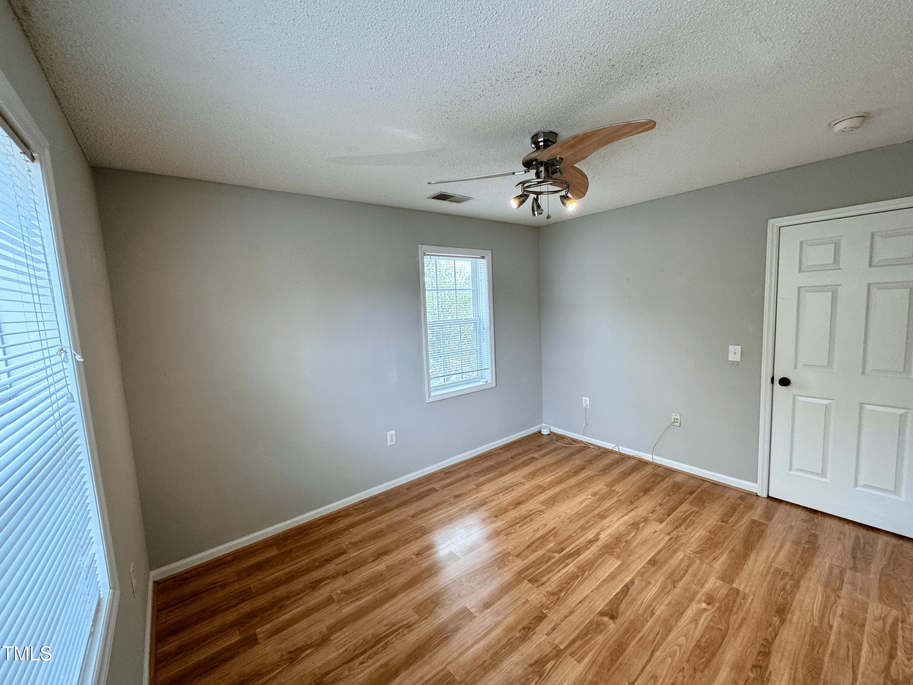 2011 Wolfmill Drive, Unit 301 Raleigh, NC 27603 - Photo 1 of 6 wooden floor in an empty room with a window