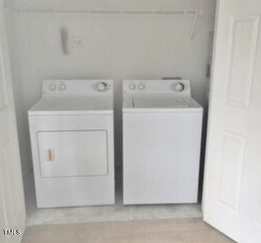 2011 Wolfmill Drive, Unit 301 Raleigh, NC 27603 - Photo 4 of 6 a utility room with dryer and washer