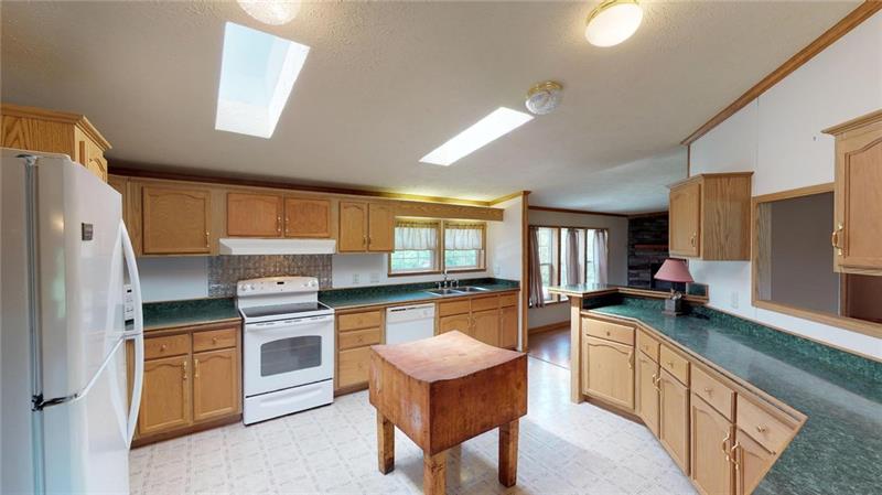 346 Hutchman Road Mars, PA 16046 - Photo 14 of 25 Plenty of Cabinets and Counter Space in this Fully Equipped Kitchen! Skylights! Tile Flooring!