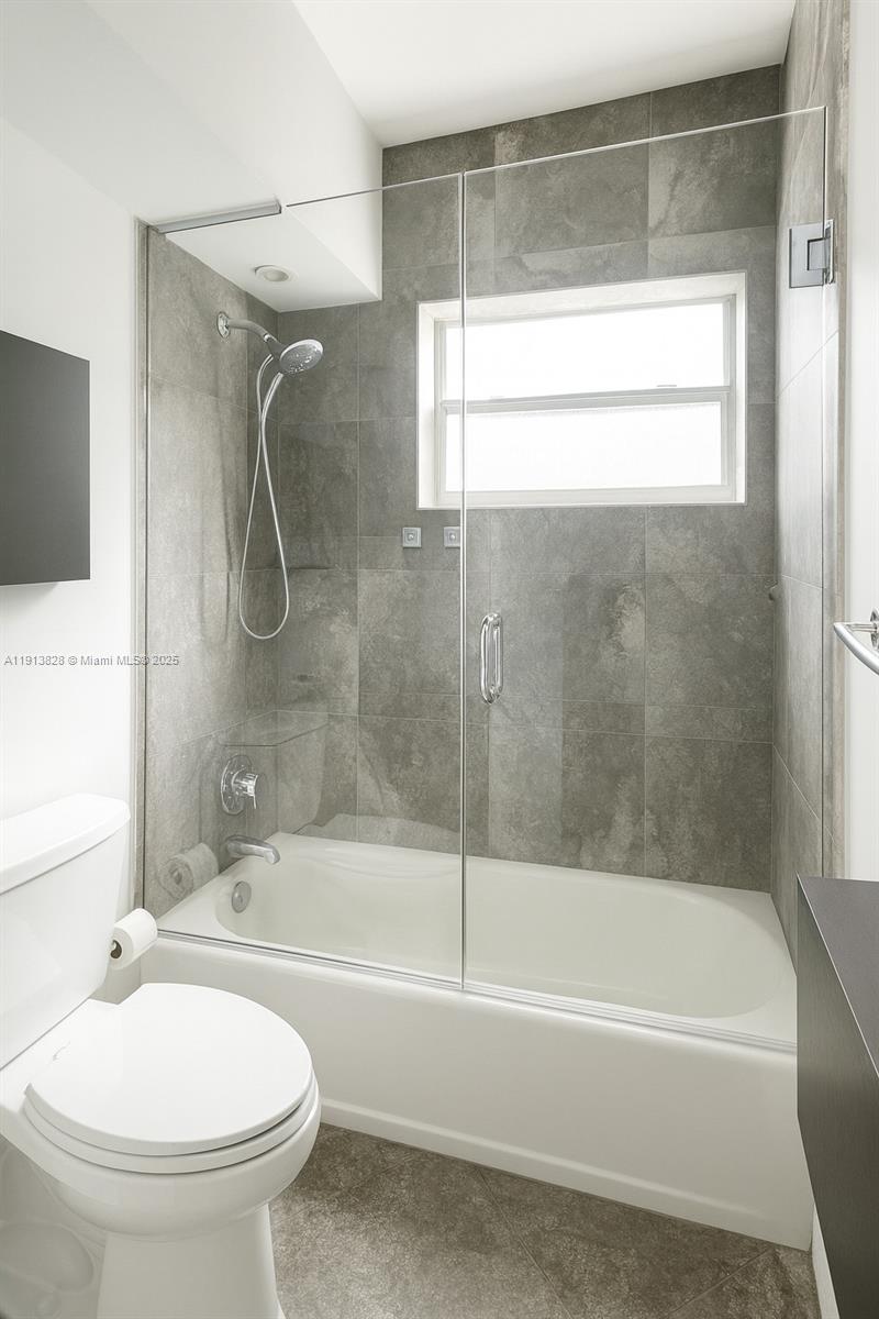 1300 Lincoln Road, Unit A301 Miami Beach, FL 33139 - Photo 13 of 13 a bathroom with a bathtub and a shower
