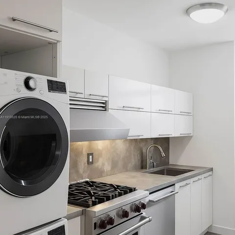 a kitchen with a stove and a microwave