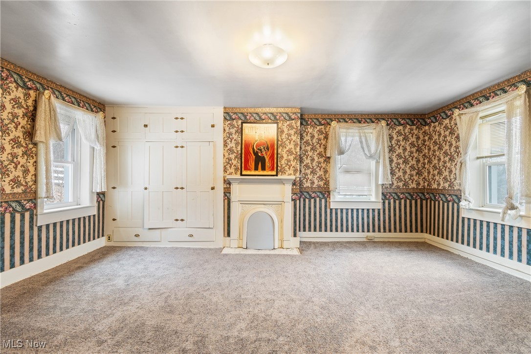 5147 Bluebird Road Northwest Malvern, OH 44644 - Photo 20 of 26 Bedroom with fireplace