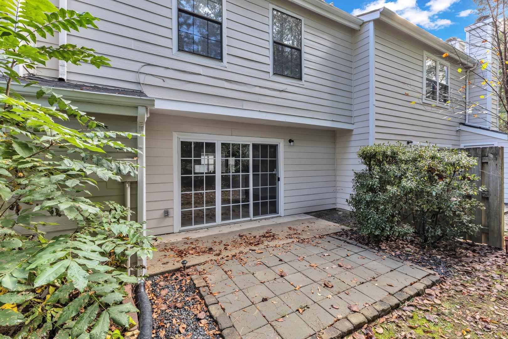 2430 Condor Court Raleigh, NC 27615 - Photo 30 of 34 a view of house with window and potted plants in front of door