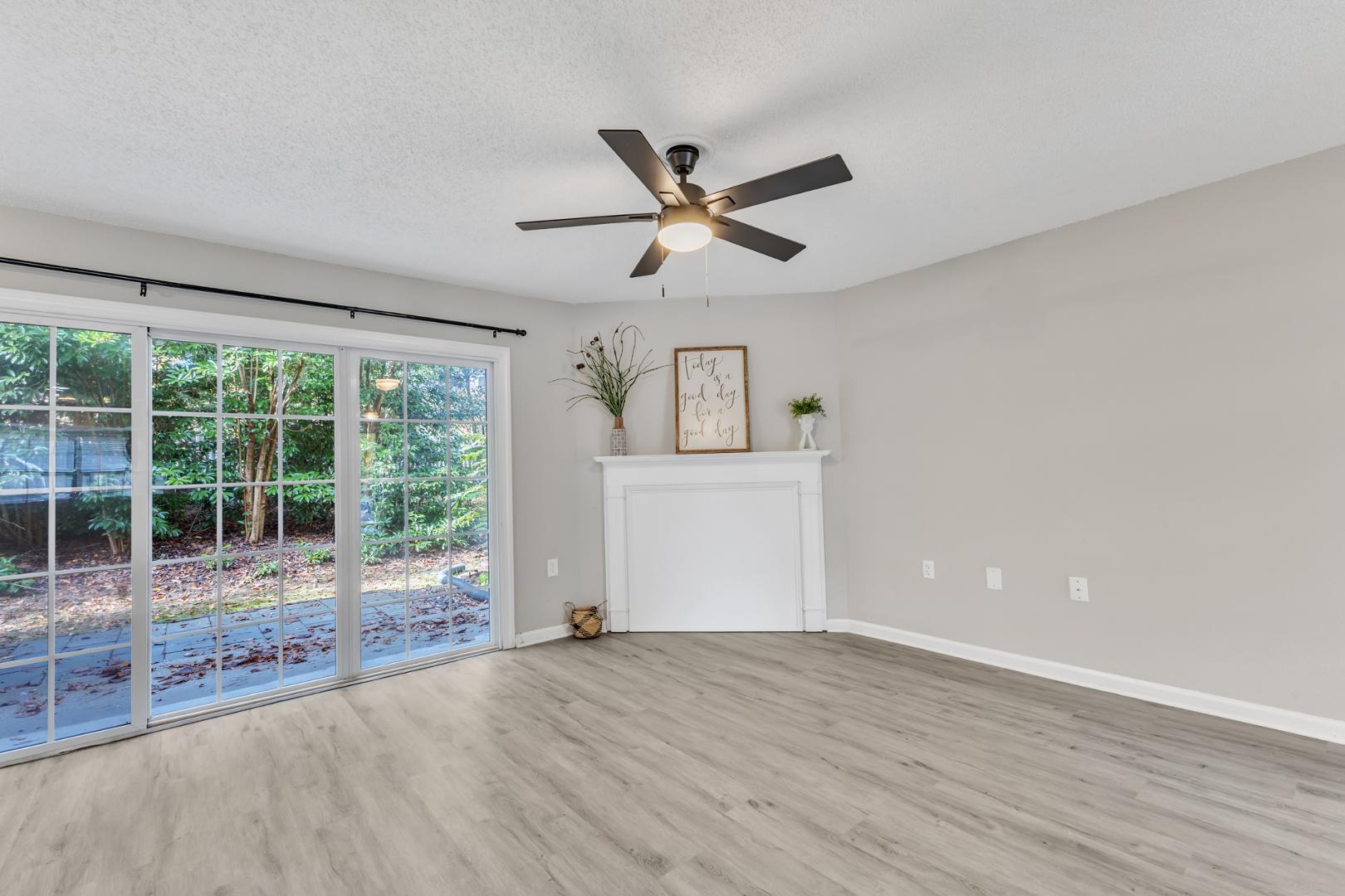 2430 Condor Court Raleigh, NC 27615 - Photo 7 of 34 a view of empty room with wooden floor and fan