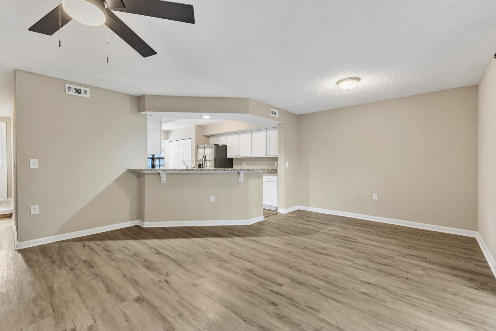2430 Condor Court Raleigh, NC 27615 - Photo 9 of 34 a view of a kitchen with a dishwasher and wooden floor