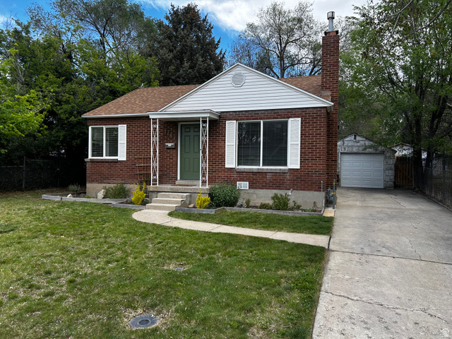 1187 East Ridgedale Circle Salt Lake City, UT 84106 - Photo 1 of 1 Bungalow with an outdoor structure, a chimney, brick siding, and concrete driveway