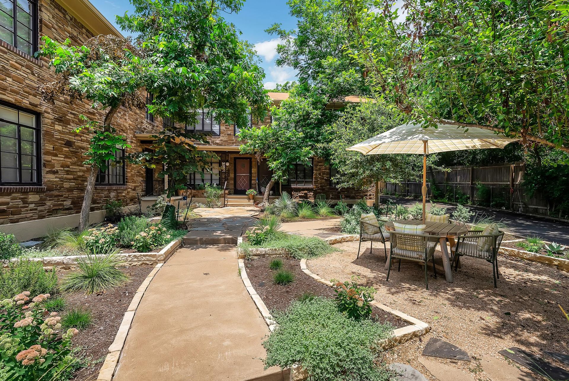 3010 Windsor Road, Unit E Austin, TX 78703 - Photo 19 of 21 a view of backyard with outdoor seating and trees
