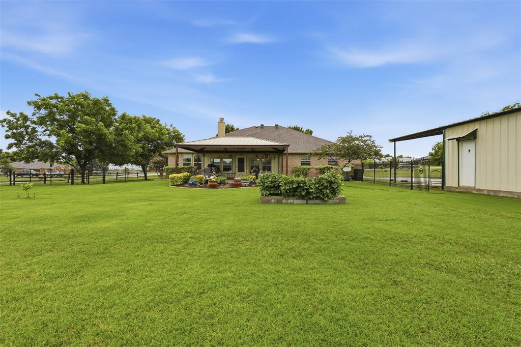 2732 Rawhide Court Haslet, TX 76052 - Photo 34 of 40 Backyard and covered porch