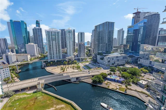 a view of a swimming pool with outdoor seating