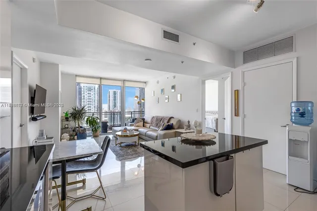a view of a livingroom with furniture and a table