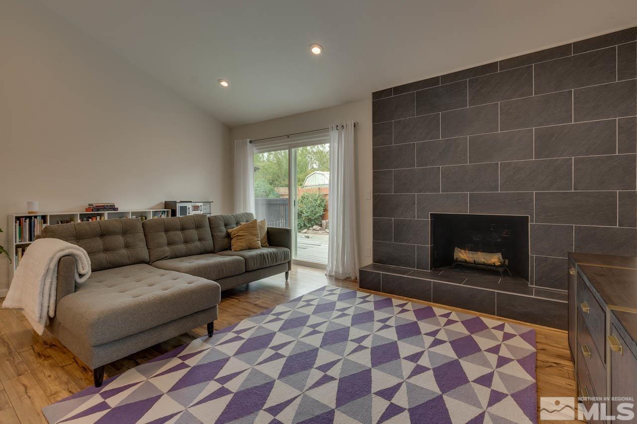 960 Twin Pines Road Reno, NV 89509 - Photo 11 of 26 a living room with a couch and a fireplace