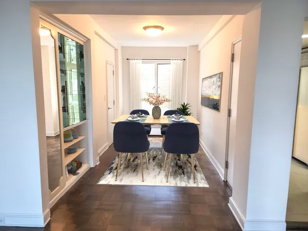a view of a dining room with furniture window and wooden floor