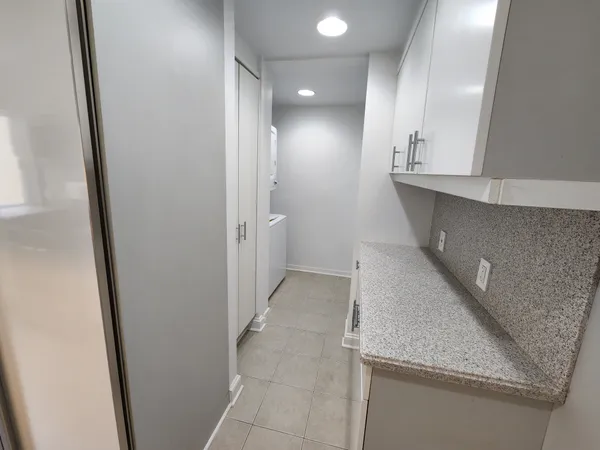 a view of hallway with kitchen