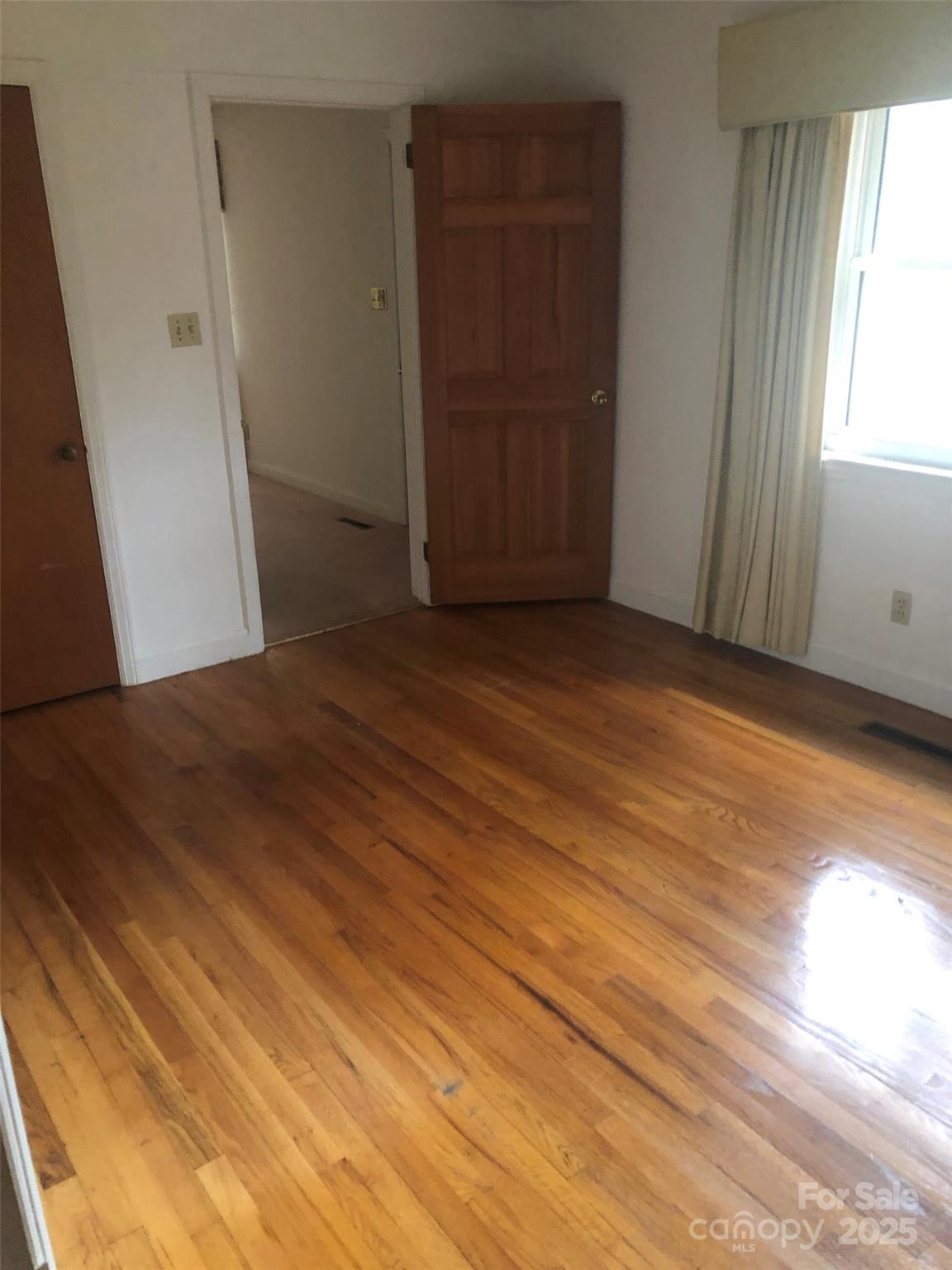 1575 Highway 220 Biscoe, NC 27209 - Photo 11 of 17 an empty room with windows and closet
