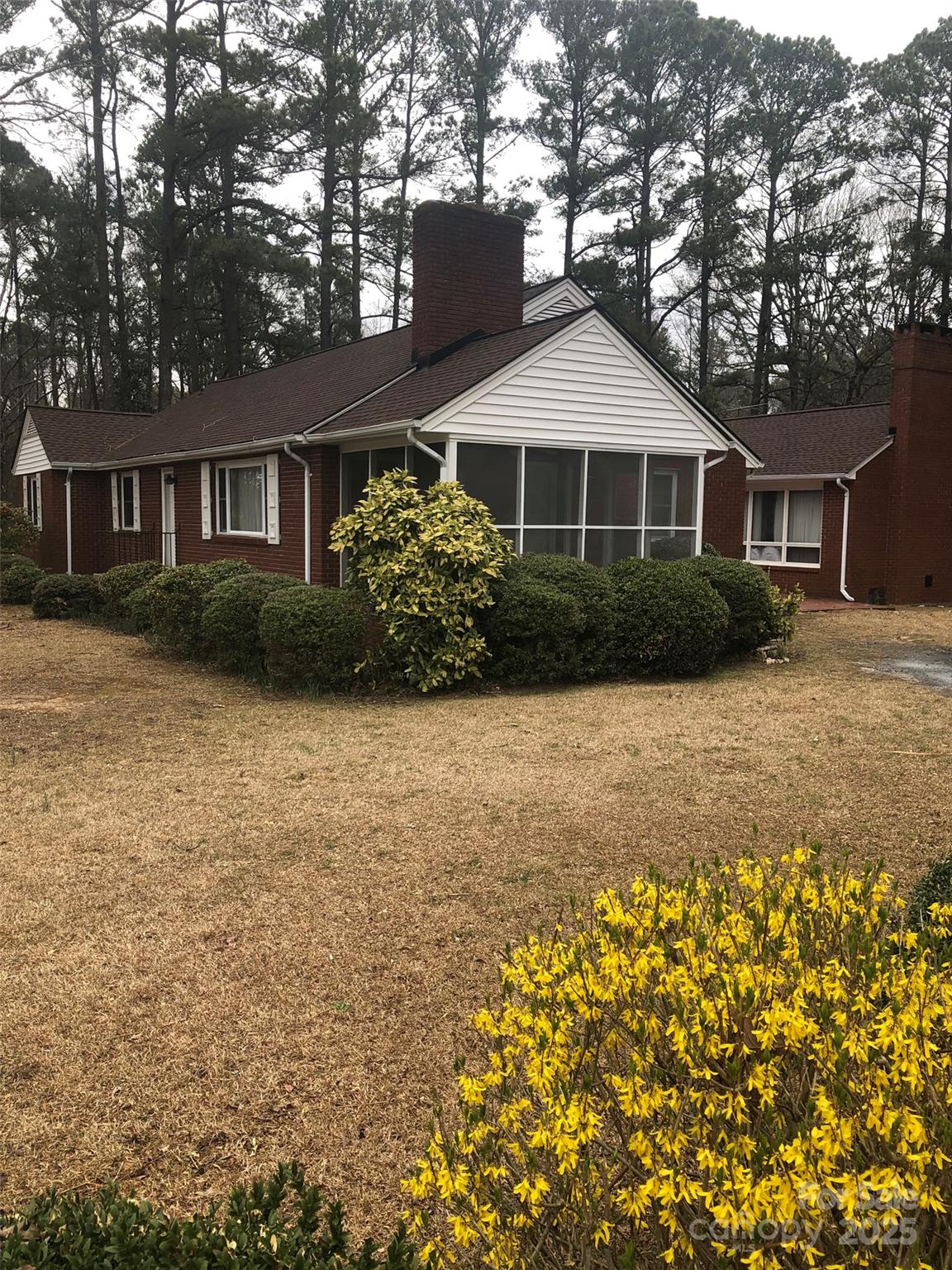 1575 Highway 220 Biscoe, NC 27209 - Photo 17 of 17 a front view of a house with a garden