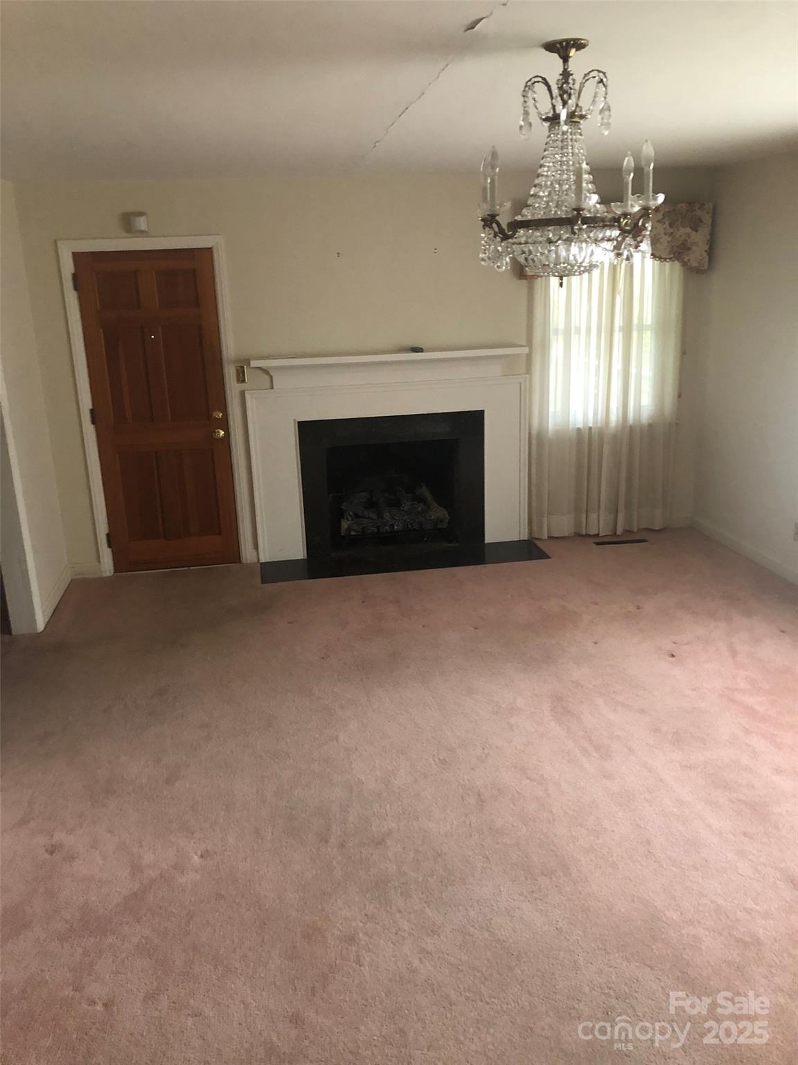 1575 Highway 220 Biscoe, NC 27209 - Photo 2 of 17 a view of empty room with a fireplace