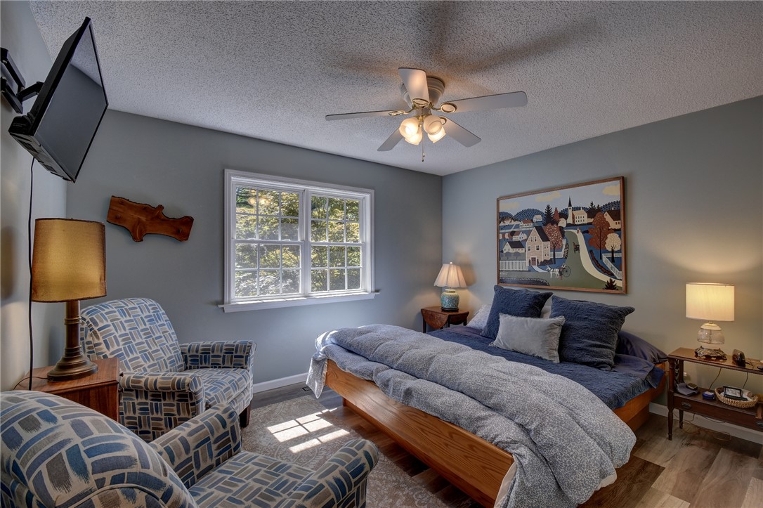 2011 Ridgeview Lane Seneca, SC 29678 - Photo 30 of 37 This cozy bedroom features a large window offering verdant views, perfect for peaceful mornings.