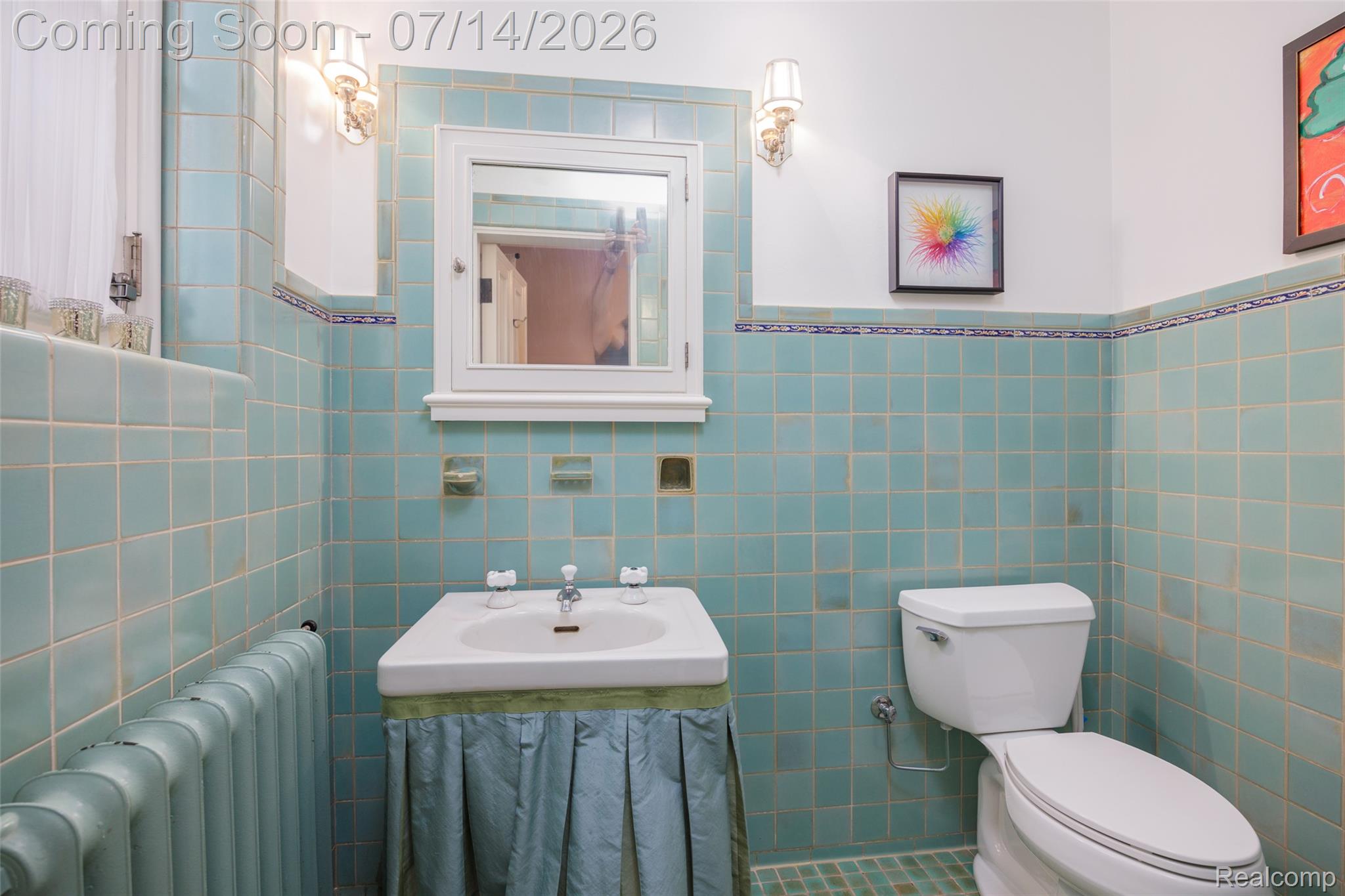 189 Cloverly Road Grosse Pointe, MI 48236 - Photo 31 of 96 Bathroom featuring full-height teal tile walls, a white pedestal sink with skirted vanity, and a white toilet