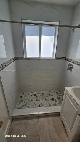 a view of backyard with outdoor seating