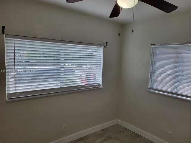 a view of a balcony with furniture