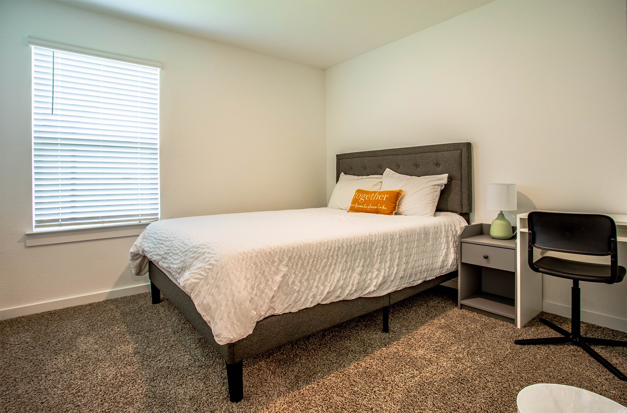 31810 Whittis Hill Way Fulshear, TX 77441 - Photo 17 of 23 Another large, light filled secondary bedroom complete with a nightstand and a desk for your use.