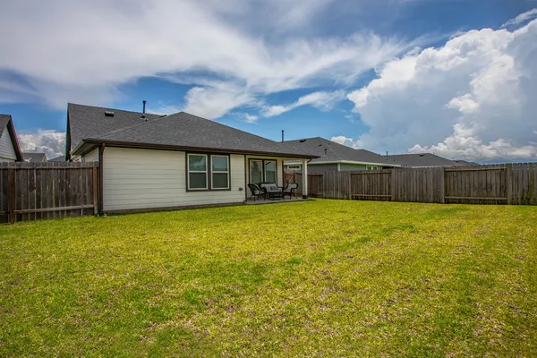 a front view of a house with yard