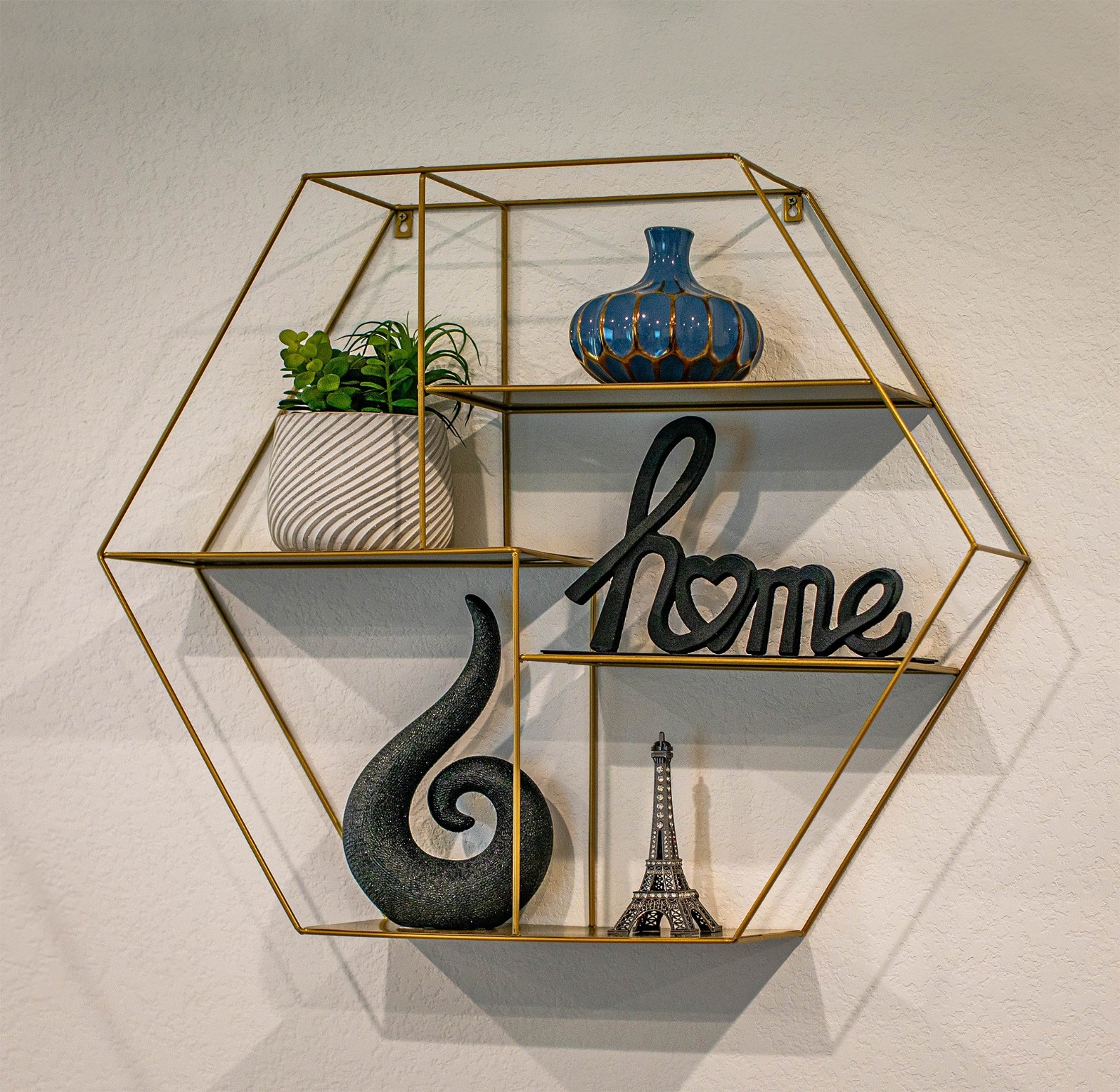 31810 Whittis Hill Way Fulshear, TX 77441 - Photo 6 of 23 Stylish curated decor pieces that create a warm and inviting “home” vibe. Perfectly blending charm and personality. It’s a standout detail in this beautifully designed interior in sought after Tamarron.