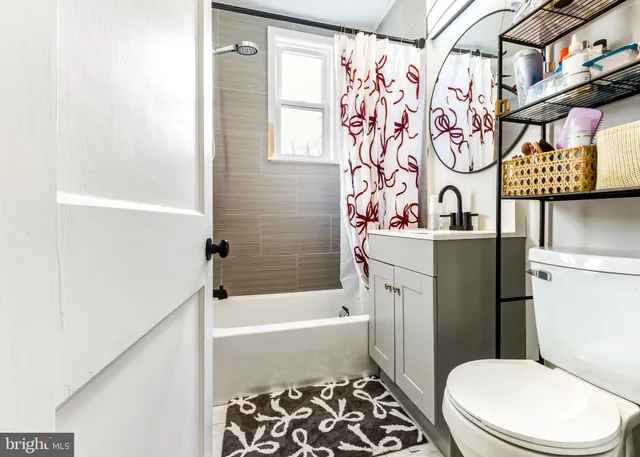 a bathroom with a toilet a sink and a bathtub