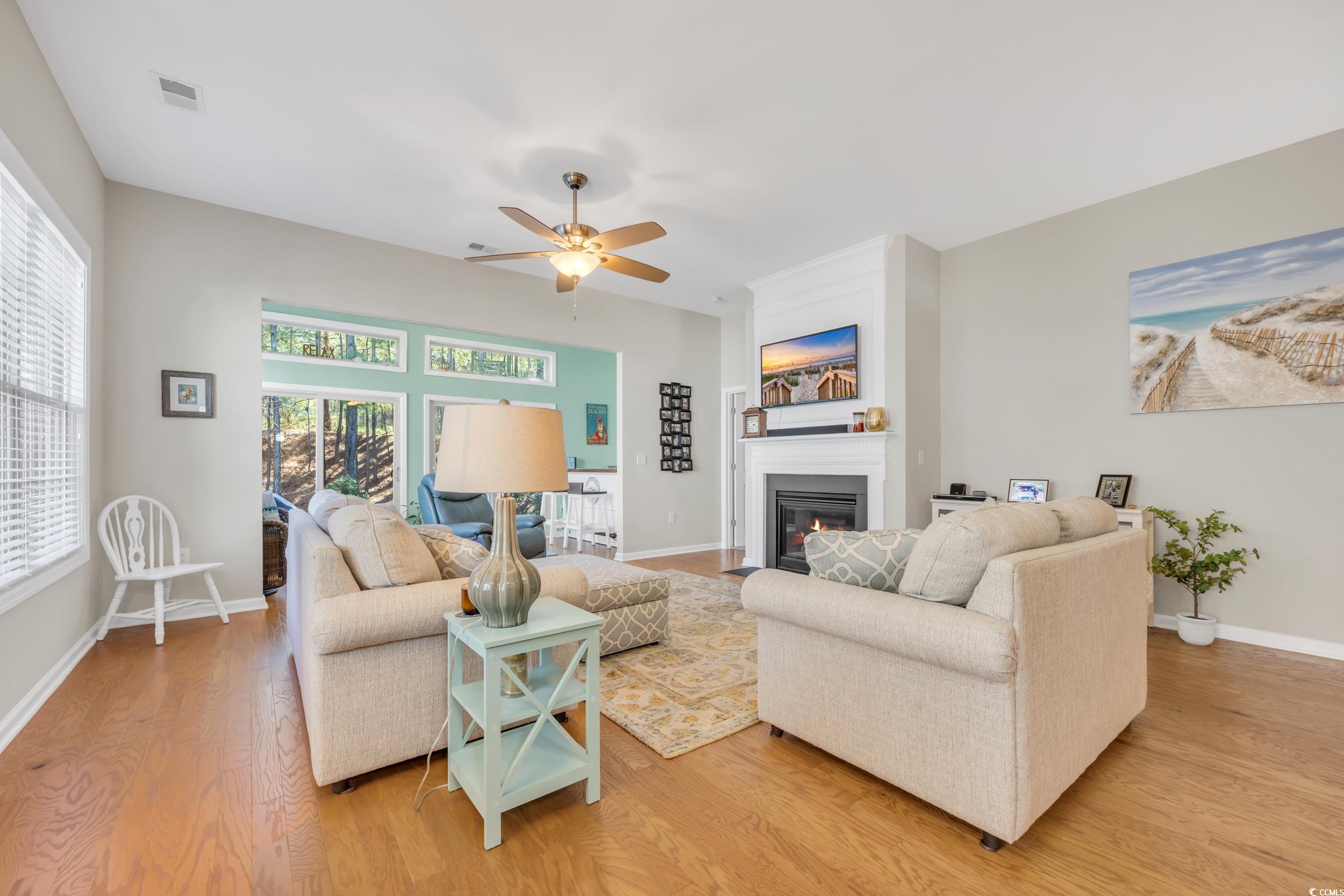 110 Summerlight Drive Murrells Inlet, SC 29576 - Photo 11 of 40 Living room featuring ceiling fan, a fireplace, an