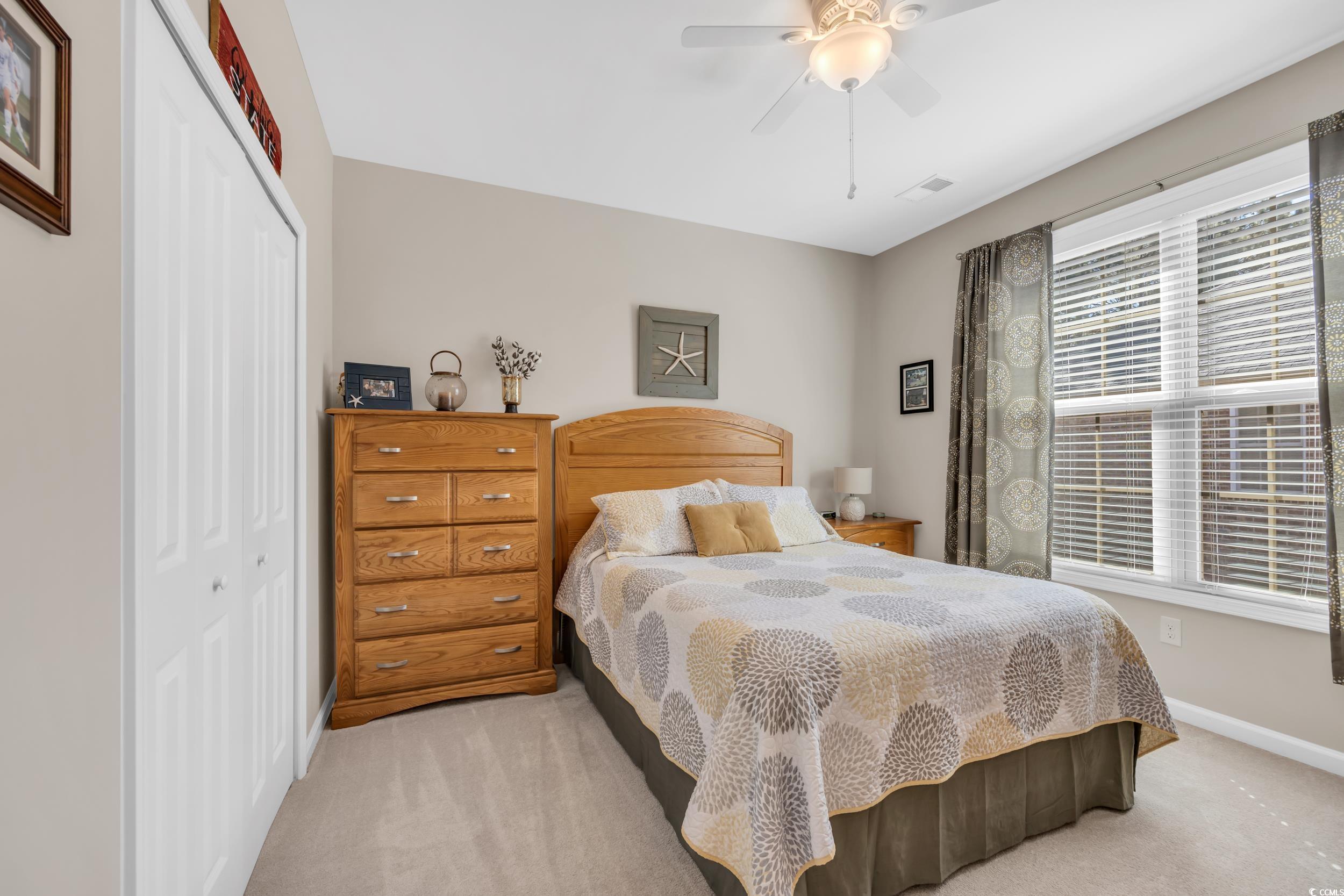 110 Summerlight Drive Murrells Inlet, SC 29576 - Photo 22 of 40 Carpeted bedroom with a closet and ceiling fan