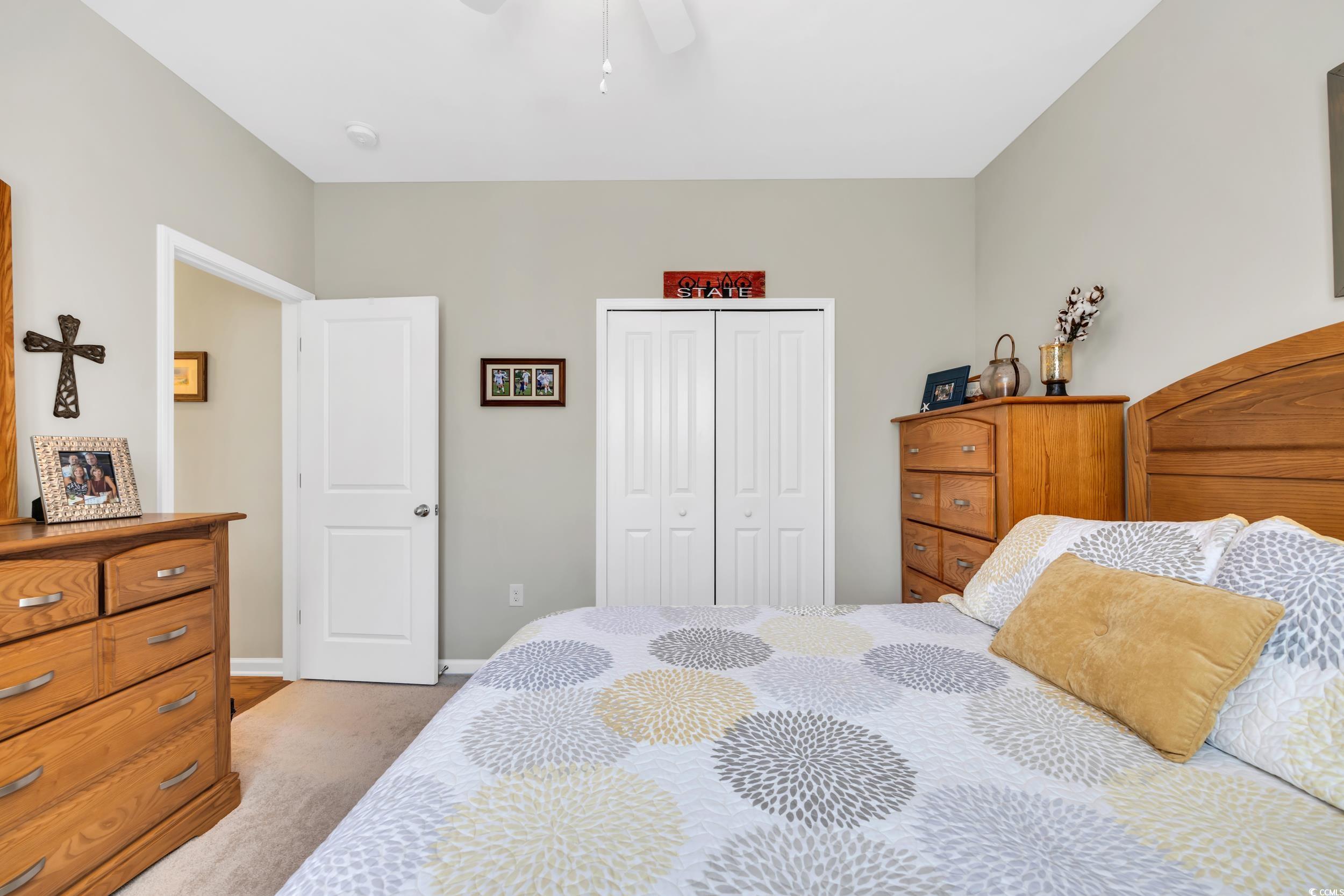 110 Summerlight Drive Murrells Inlet, SC 29576 - Photo 23 of 40 Bedroom featuring ceiling fan, light carpet, and a