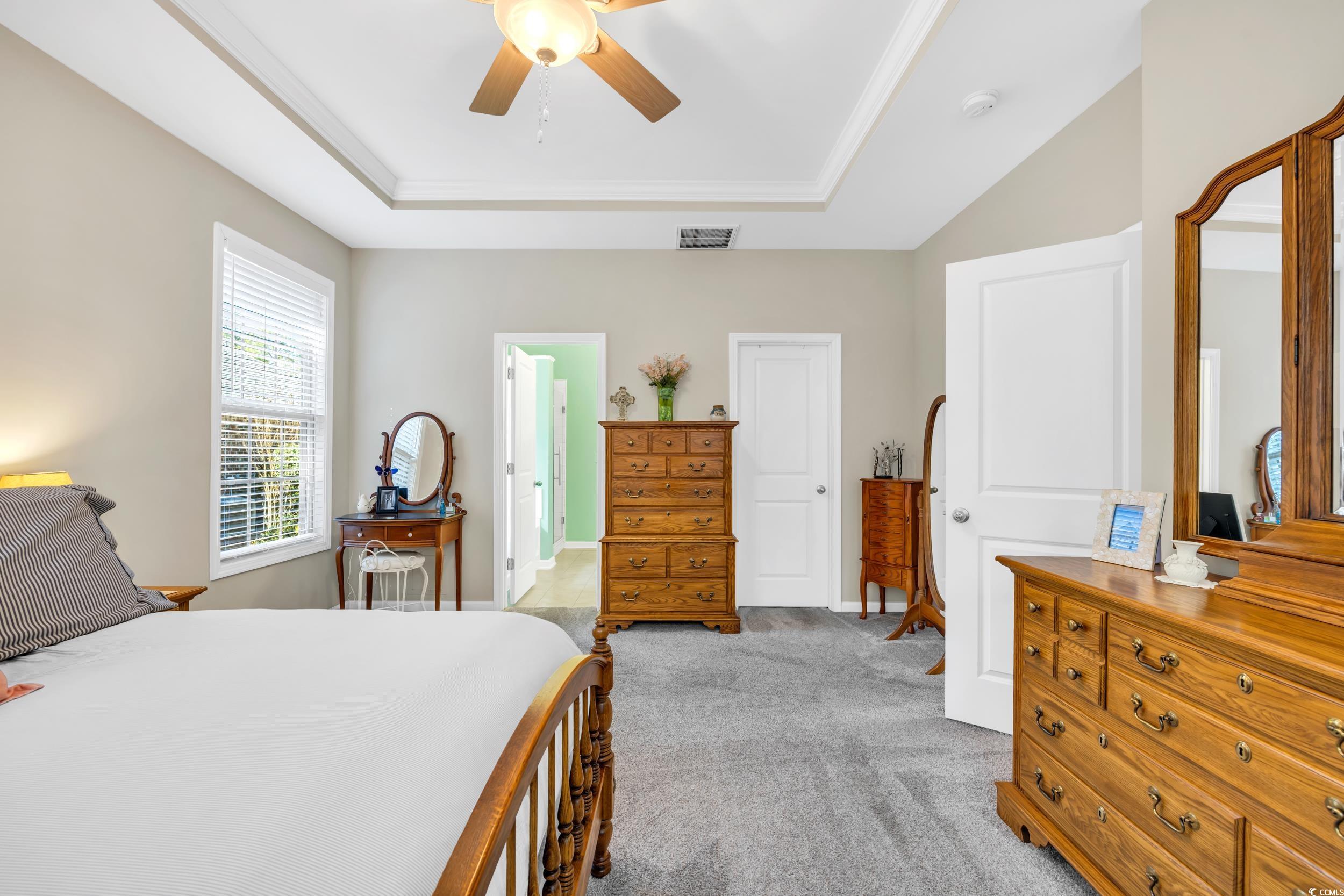 110 Summerlight Drive Murrells Inlet, SC 29576 - Photo 25 of 40 Bedroom featuring light colored carpet, a raised c