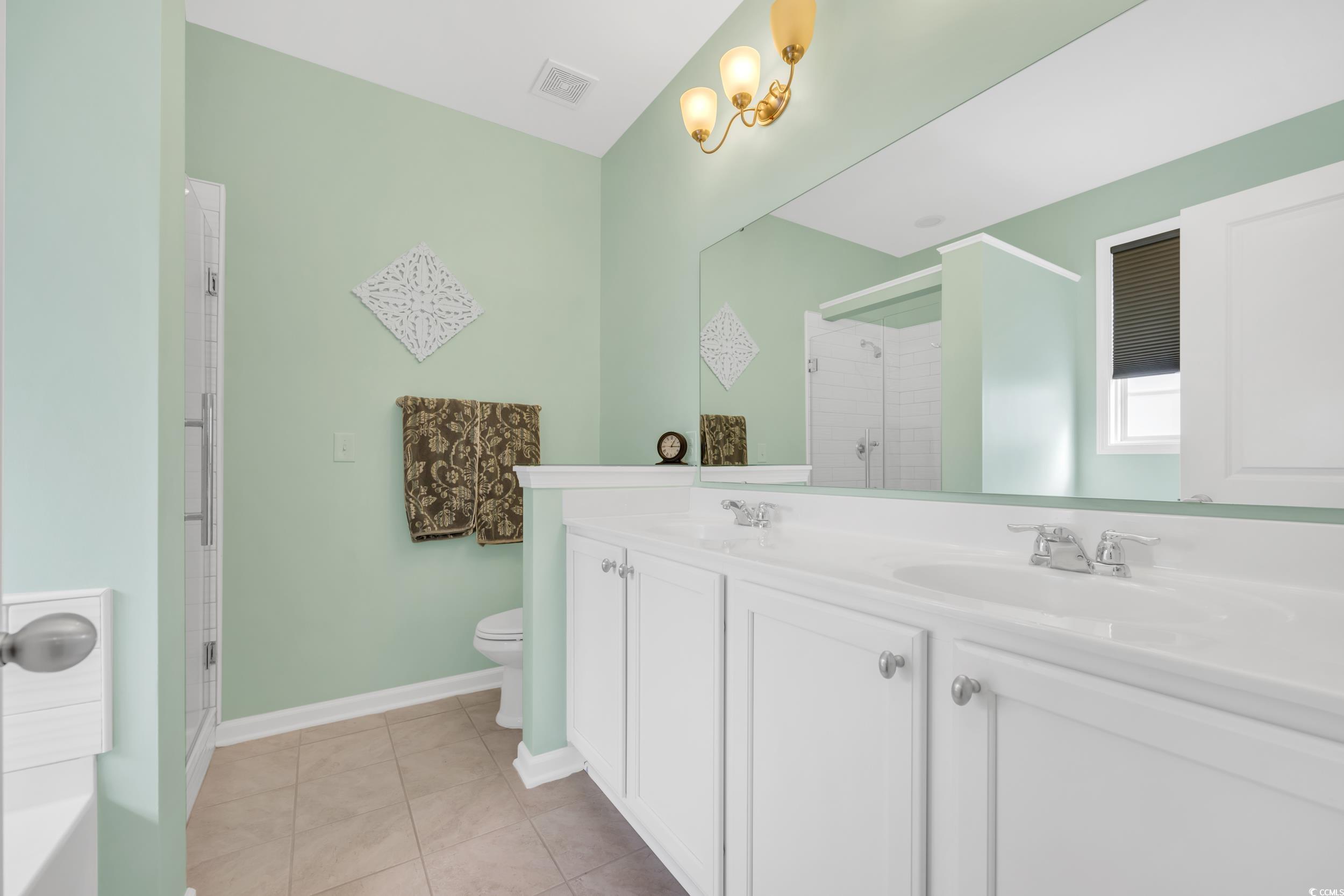 110 Summerlight Drive Murrells Inlet, SC 29576 - Photo 27 of 40 Bathroom with vanity, an enclosed shower, tile pat