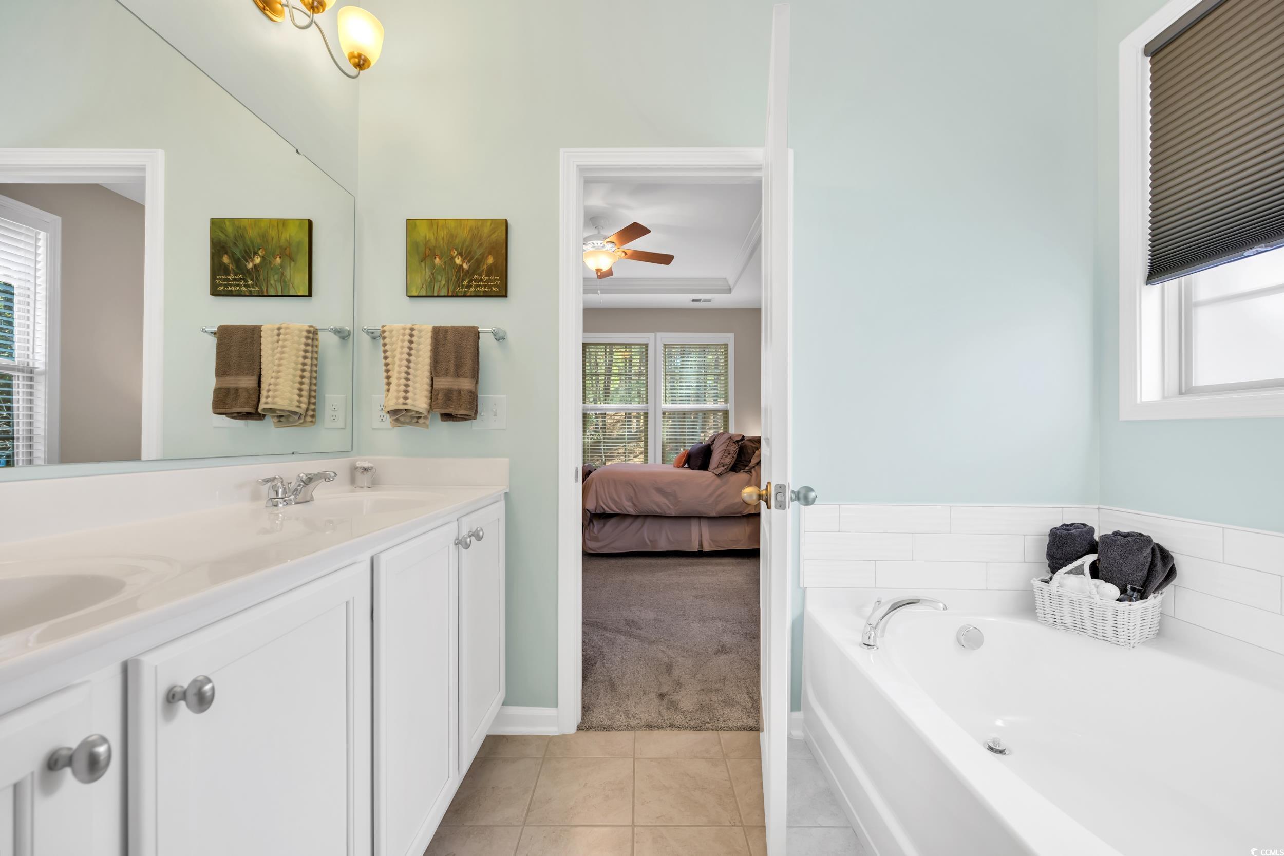 110 Summerlight Drive Murrells Inlet, SC 29576 - Photo 29 of 40 Bathroom with tile patterned flooring, vanity, and