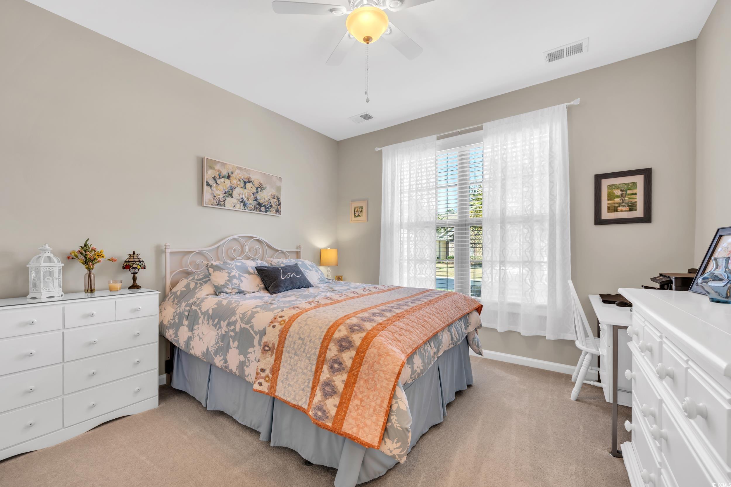 110 Summerlight Drive Murrells Inlet, SC 29576 - Photo 6 of 40 Bedroom with light colored carpet and ceiling fan