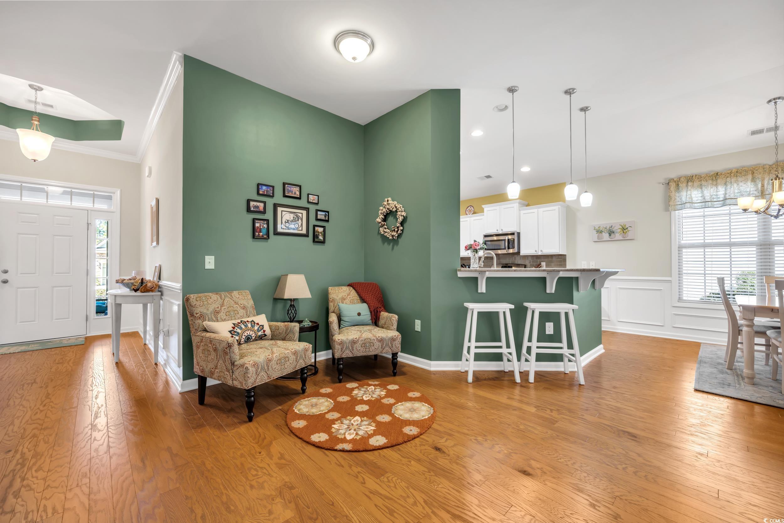 110 Summerlight Drive Murrells Inlet, SC 29576 - Photo 9 of 40 Living area featuring crown molding, a chandelier,