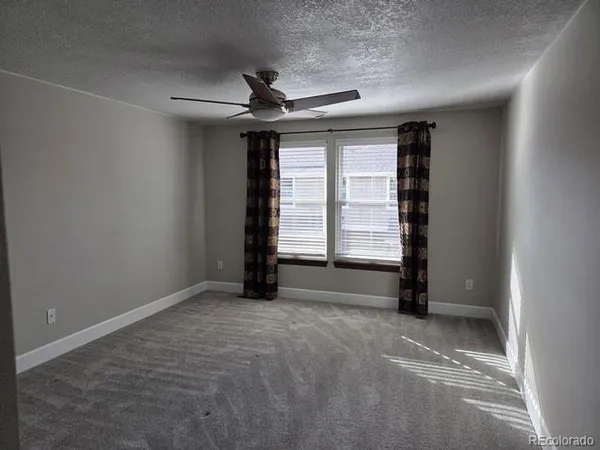 a bathroom with a shower and a toilet