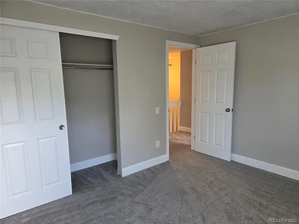 a living room with a table and chairs